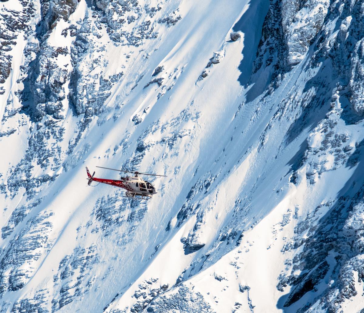 Helicopter heliskiing steep alpine terrain, North America